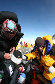Snow Blindness climber Farouq attended by Tim Rippel